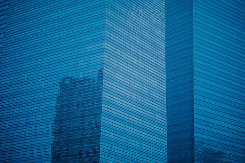 office building high-rise building with glass windows blue